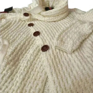 Soft creamy white sweater with brown buttons and beautiful cowl neck.Size Large